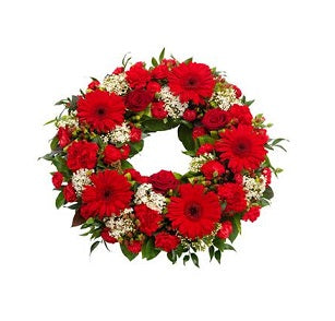 rouwkrans met rode bloemen