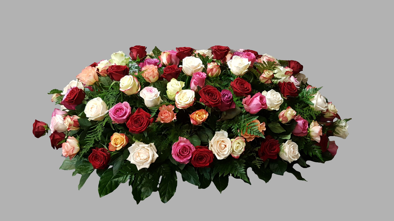 Bonte rozen rouwbloemstuk