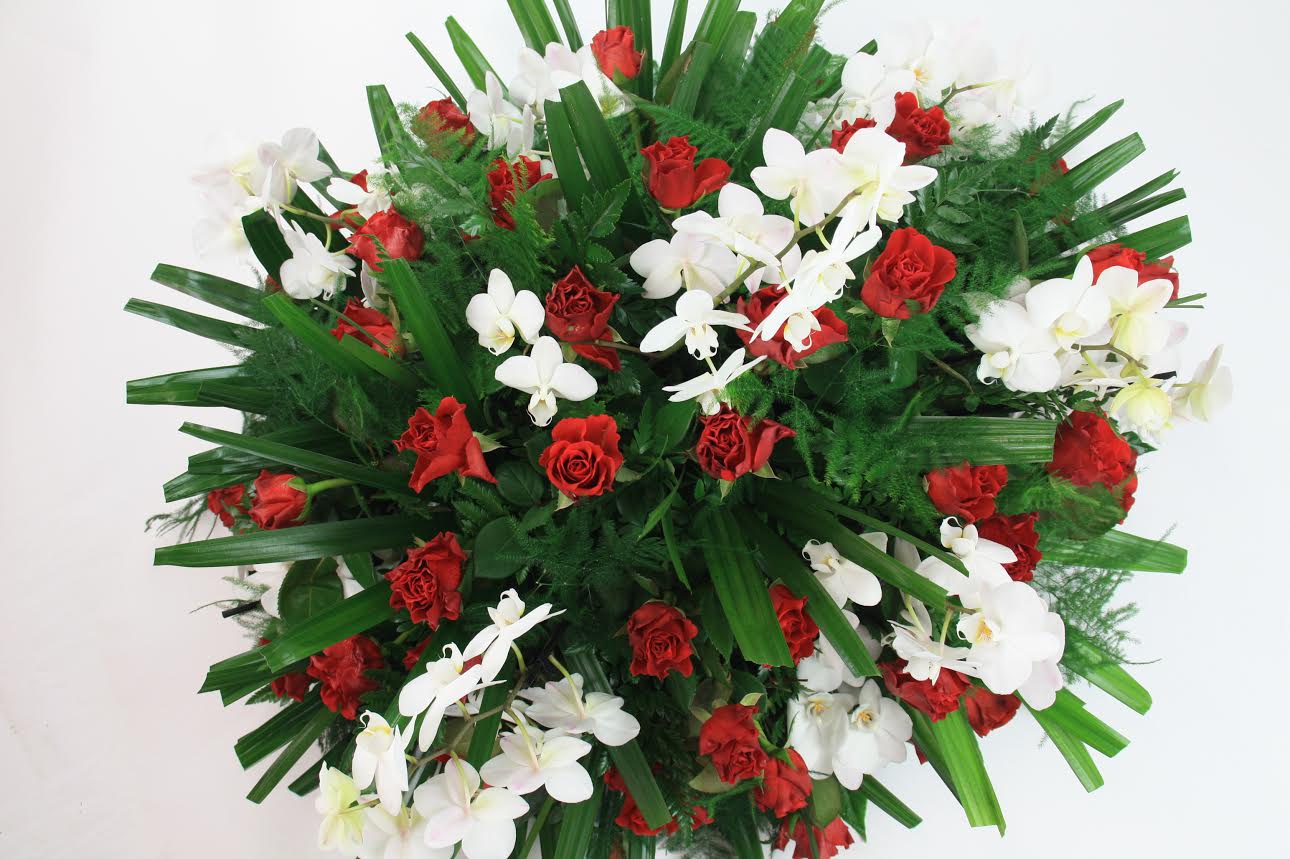 roos en orchidee rouwstuk rood